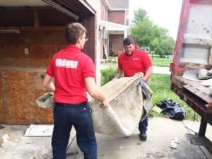 Image of carpet being removed in Indianapolis by Fire Dawgs Junk Removal