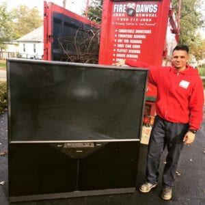 image of television being removed by Fire Dawgs Junk Removal in indianapolis